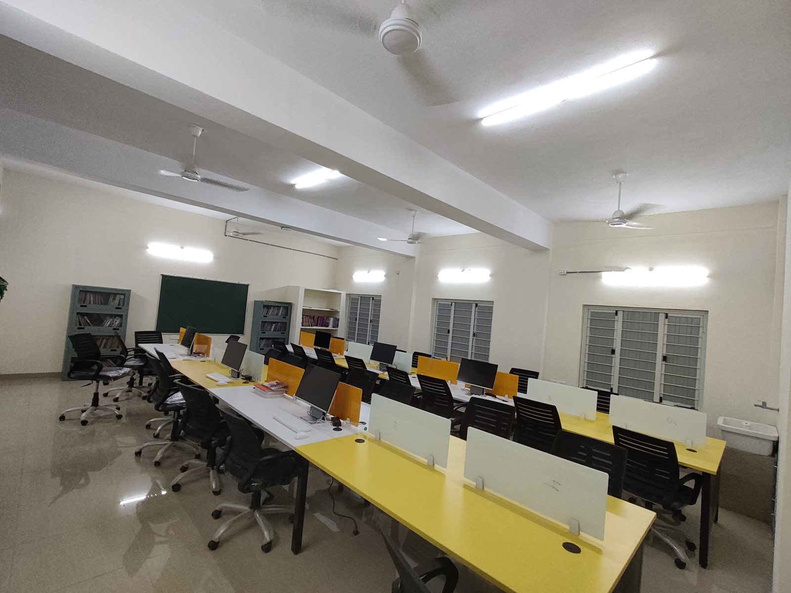 Rows of computer terminals inside the Digital Library