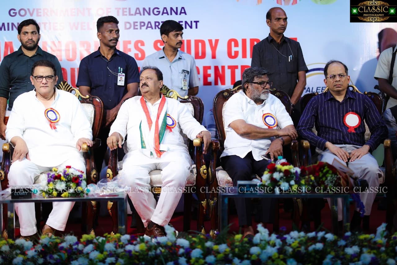 Dignitaries seated on stage at a Study Circle event