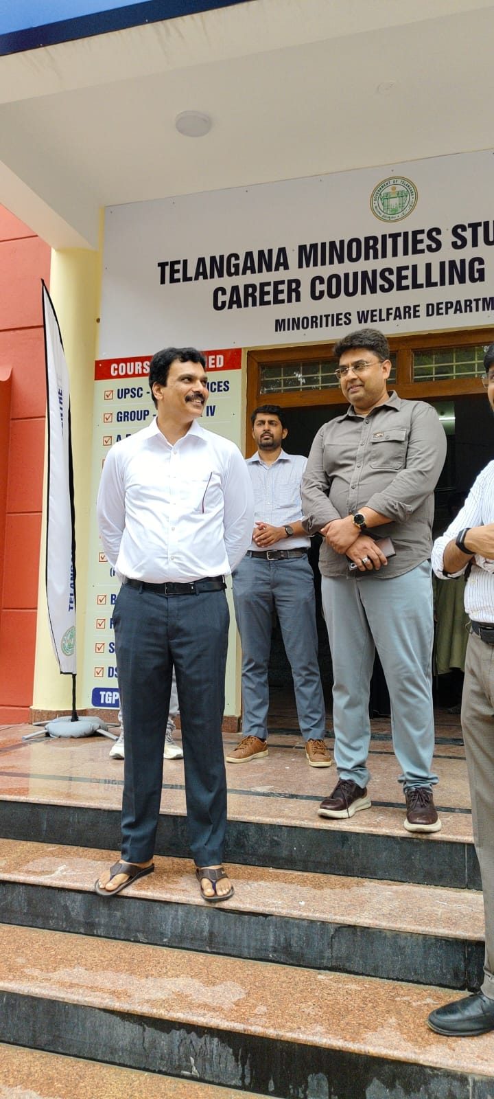 Visiting official addressing staff and students